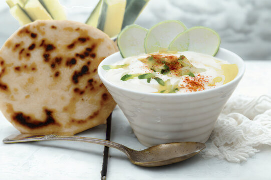 Savory yogurt dip with fresh flatbread and spices