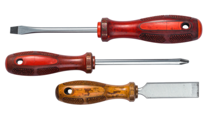 Three well-worn hand tools, a flathead, Phillips, & chisel, rest against a stark black background