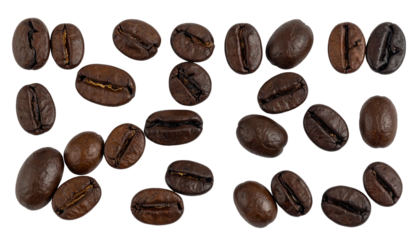 Glossy dark coffee beans scattered across a black background with uneven lighting
