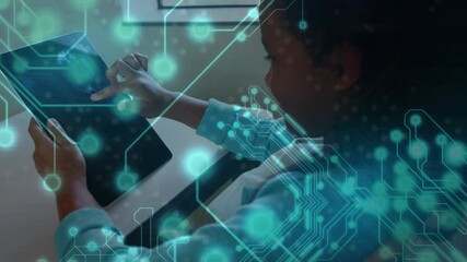 Girl student tapping and swiping tablet display with circuit overlay pulsating for educational use - Powered by Adobe