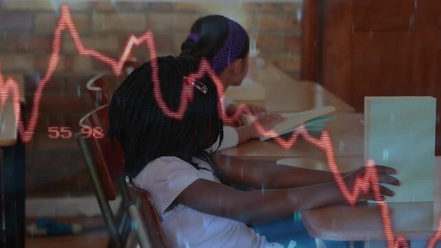 Two students scanning workbooks while transparent red line graph fading showing education progress