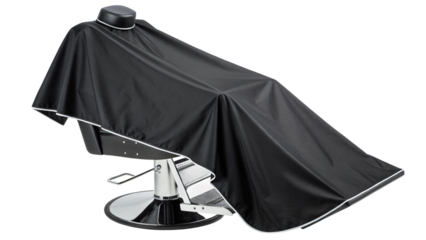 A black barber cape draped over a salon chair, isolated on transparent background