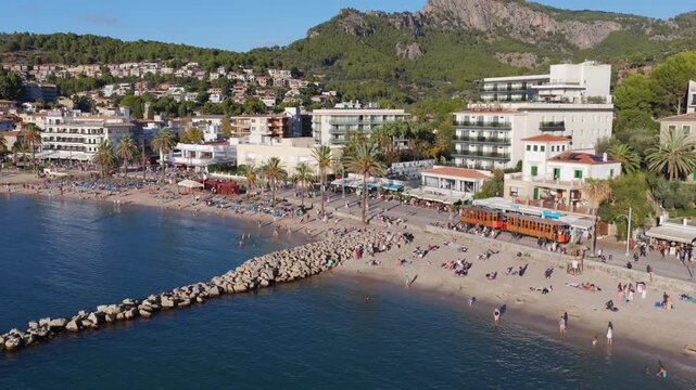 Golden Hour Aerial Panorama of Port Soller Harbor and Tramuntana Mountains in Mallorca, Spain