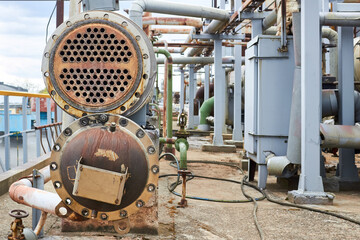 Industrial heat exchanger or boiler tubes bundle. Two way heat exchanger shell and tubes, header, tube inlet and tube outlet opened for repairing and deposits cleaning at petrochemical enterprises.