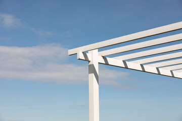 White metal slats roof with blue sky background