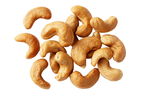 Cluster of crescent-shaped, beige nuts is brightly lit against a stark black background