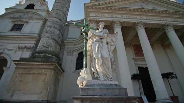 Architecture Karlskirche Vienna Austria. Statues at the entrance to the church urban landscape of the streets of tourist Europe.