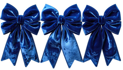 Three blue velvet bows with elegant folds, lined up against a dark background
