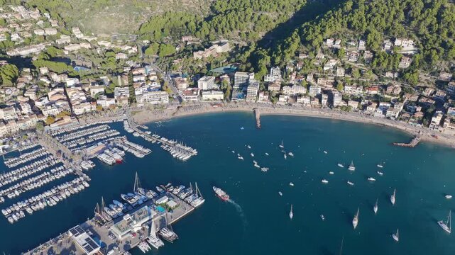 Golden Hour Aerial Panorama of Port Soller Harbor and Tramuntana Mountains in Mallorca, Spain
