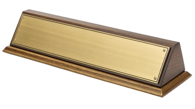 A wooden desk nameplate with a brass insert and decorative border, isolated on transparent background