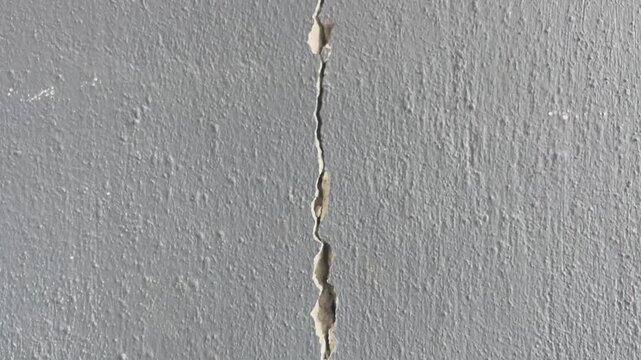 Cracked Plastered Wall Panning Downward 4K Stock Video

