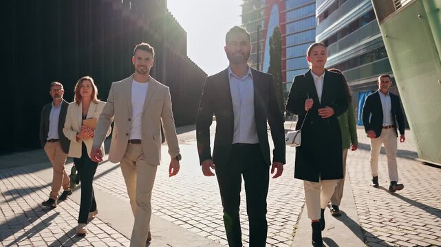 Indian business leader man walking together with company Team - Group of professionals in the city