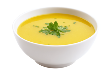Bowl of creamy yellow soup with parsley garnish