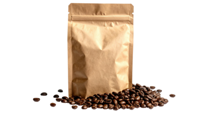 Brown kraft paper bag, partially open, stands with heap of coffee beans spilled in front. Black backdrop, neutral lighting