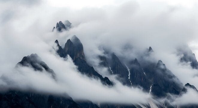 Misty Mountain Peaks Emerging from Clouds.