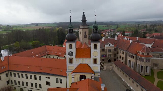 Aerial drone shot showing the historic Tel&Auml;  Chateau and the tall spire of the Church of St. Jacob in the UNESCO World Heritage town of Tel&Auml; , Vysocina, Czech Republic.