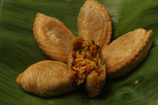 karipap isolated on banana leaf