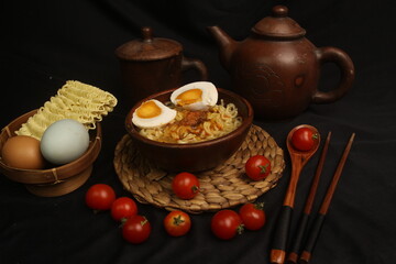 a bowl of noodles with slice eggs