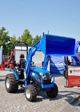 Blue Solis tractor with front loader at exhibition