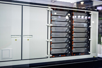Modern industrial battery energy storage system (BESS) cabinet with visible battery modules,...