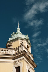 Fototapeta premium Closeup view of ornate architectural tower and clear blue sky in Belgrade, Serbia
