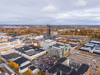 Fototapeta premium Kista district with a motorway in the background, in autumn after rain, aerial view, Stockholm, Sweden