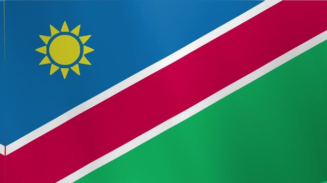 Waving flag of Namibia with red stripe and yellow sun.