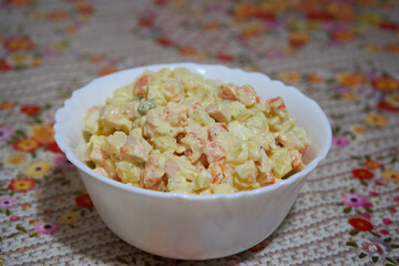 Olivier salad, Homemade festive salad for New Year's Eve on the table