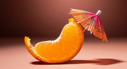 Orange slice with a cocktail umbrella on a peach background citrus fruit