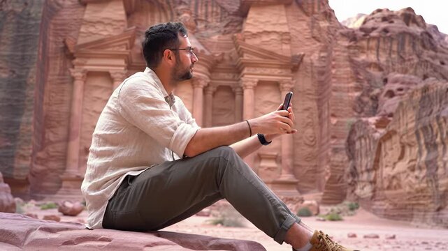 A gender-neutral modern traveler, 25-40s, in linen shirt, calmly captures a grand, iconic destination with smartphone in golden hour, cinematic lens flares, bokeh. Concept of modern travel and