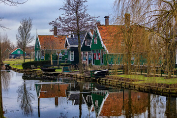 De Zaanse Schans is a neighborhood located in the city of Zandam. Historical windmills and old houses were relocated here to create the vintage look. And the famous Dutch canals near Amsterdam