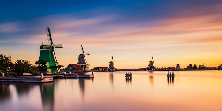 De Zaanse Schans is a neighborhood located in the city of Zandam. Historical windmills and old houses were relocated here to create the vintage look. And the famous Dutch canals near Amsterdam