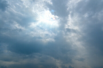 Fototapeta premium The sun and sunlight beginning to appear through the clouds