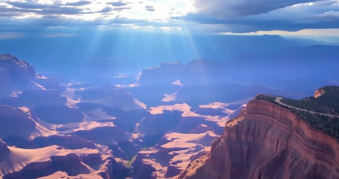 The summer sun setting over the hills provides a natural panoramic view of the cloudy sky and distant mountain peaks.