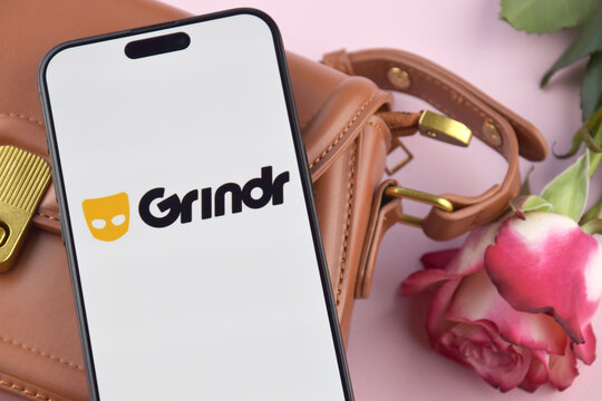 Grindr dating app on smartphone screen.