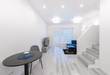 Modern Home Living Room Interior with Open TV Area and TV on the Wooden Desk