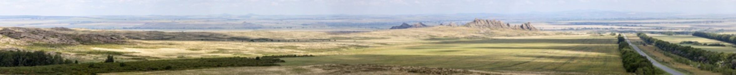 Obraz premium panoramic aerial view of hills, mountains and summer fields 