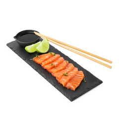 Fresh salmon sashimi with microgreens, lime, chopsticks and soy sauce isolated on white