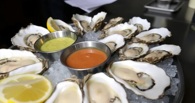 oysters with lemon and sauce
