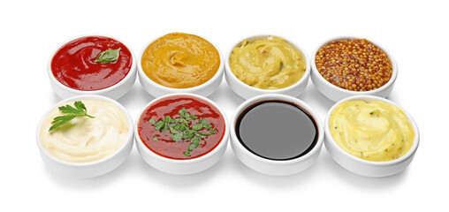 Different sauces and herbs isolated on white