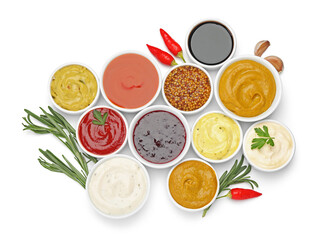 Different sauces and herbs isolated on white, top view