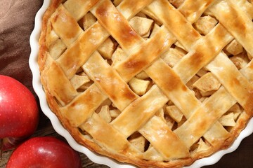 Tasty homemade apple pie and fresh fruits on wooden table, flat lay