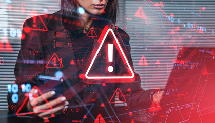 Woman receiving cyber attack warning alert on digital interface