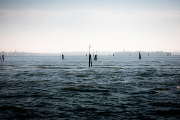  Wooden poles in Venetian lagoon