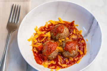 meat balls in sauce and cheese
