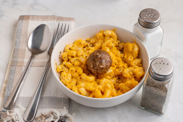 macaroni and cheese  with an italoan style meatball