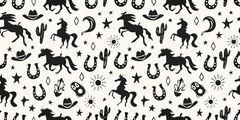 Whimsical black silhouette western cowboy pattern with horses cacti and horseshoes