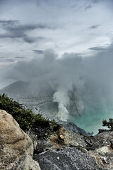 Sulfurous fumes above the toxic turquoise waters