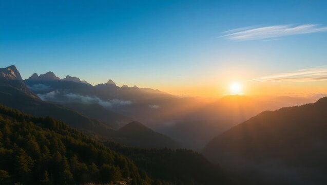 Dramatic mountain sunset with golden light and vibrant blue sky scenery