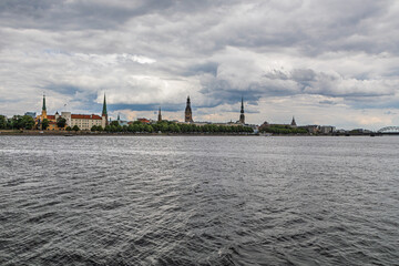 Panoramic view of Riga castle known as official residence of the President of Latvia. View of the old town across the Daugava River. Church towers of Riga